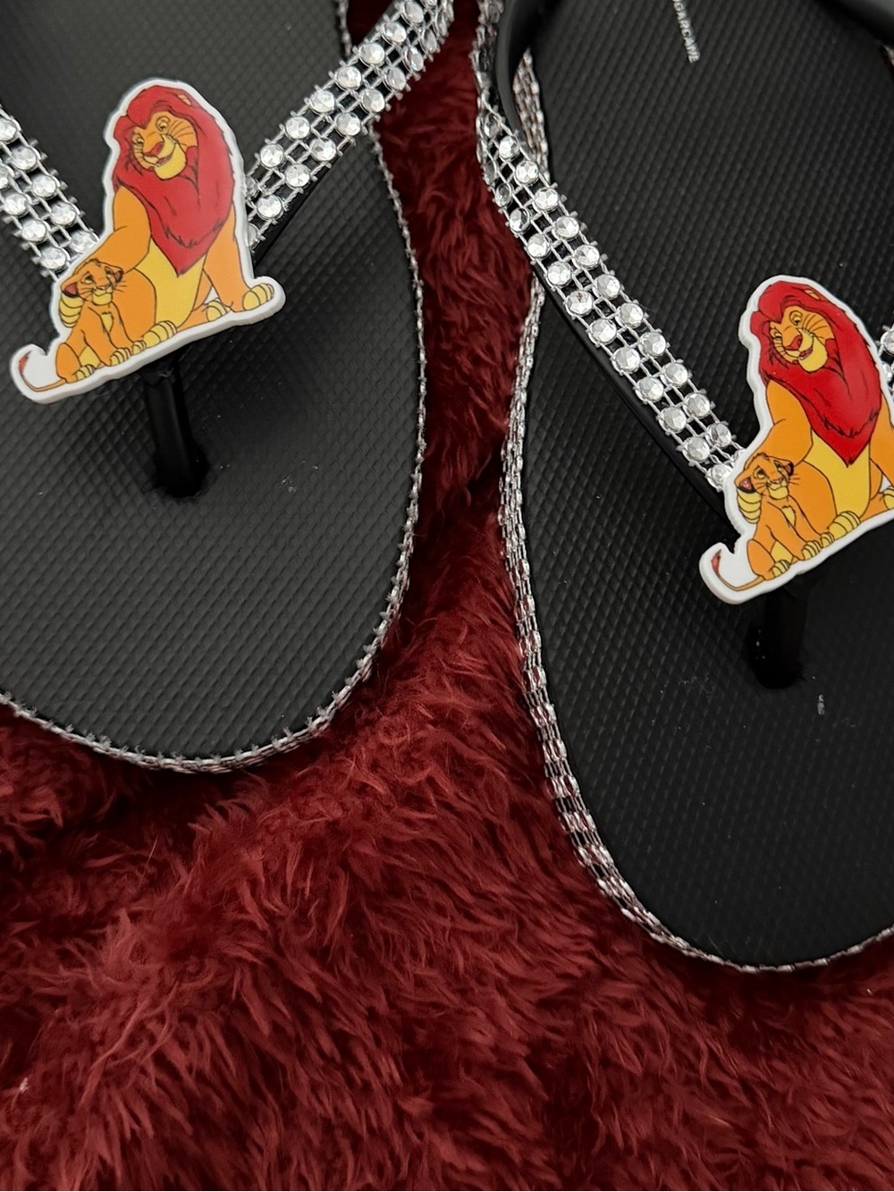 Black Rhinestone Flip Flops with Lion Accent